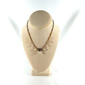 16 INCH GOLD TONE NECKLACE WITH NUMEROUS BRILLIANT RHINESTONES.